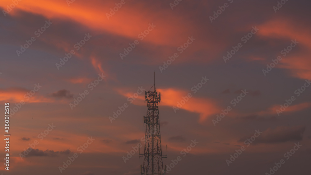 Telecommunication mast TV antennas in the afternoon ,on the hill sunset sky with cloud bright at Phuket Thailand.