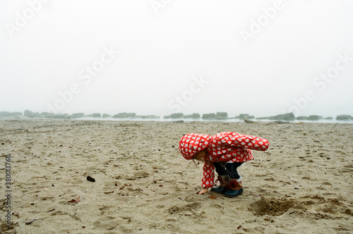 chid on foggy beach