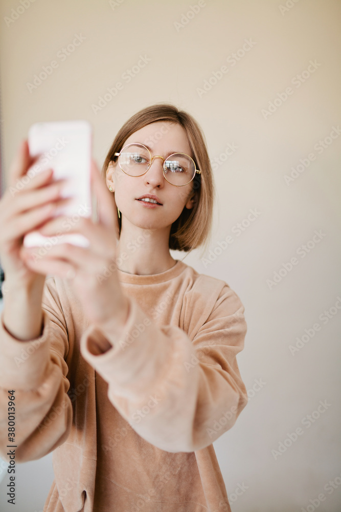 Cute woman making selfie via cell phone Cute woman making selfie via cell phone