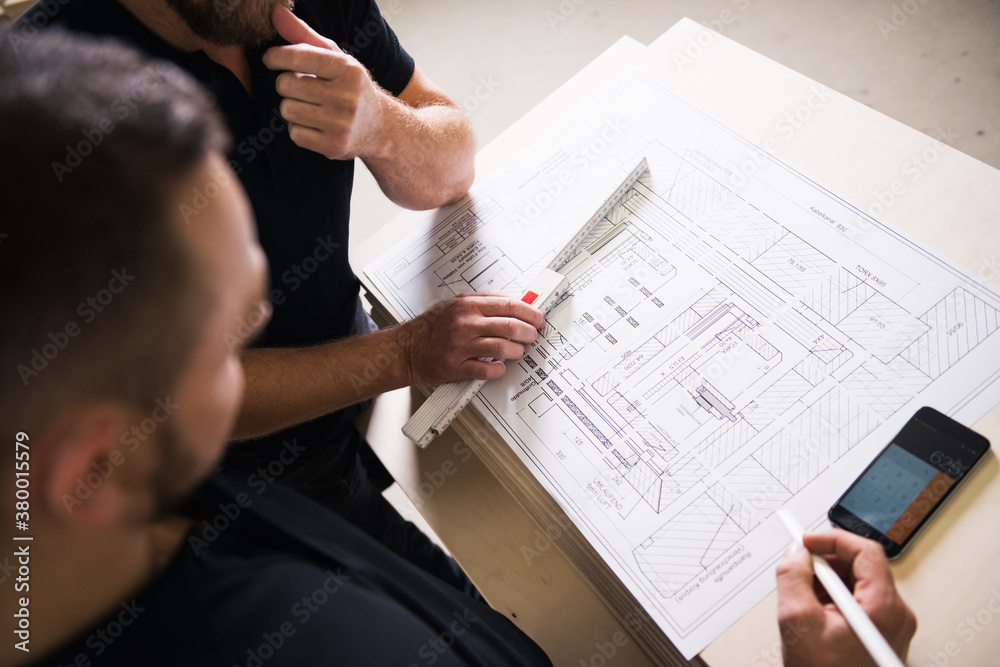 © Urs Siedentop & Co/Stocksy - Carpenters planing project