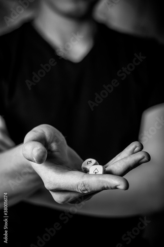 person holding a bottle of perfume