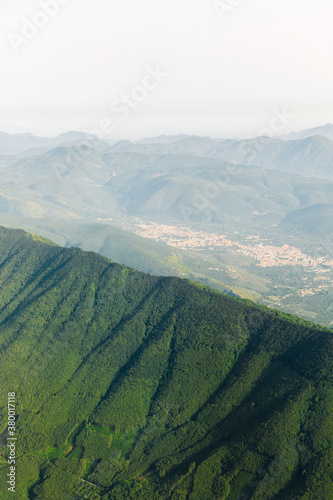 Mountain view from airplane elyuminatory photo