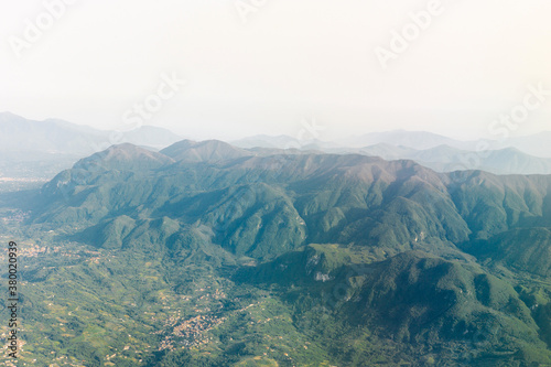 Mountain view from airplane elyuminatory photo