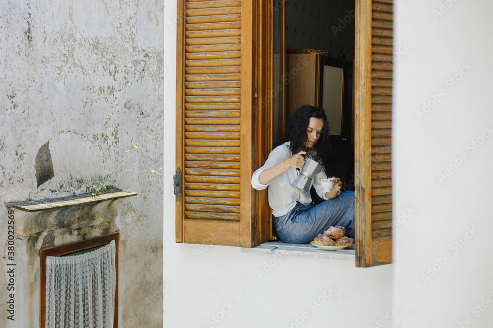 Woman looking out of window Woman looking out of window