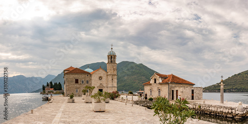 Beautiful panorama of Our Lady of the Rocks (Gospa od Skrpjela) island and church near Perast in the Bay of Kotor, Montenegro. One of the two islets off the coast of Perast