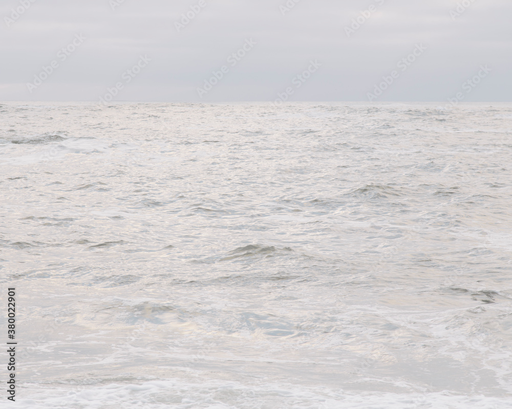 View of Pacific ocean and breaking waves at dusk View of Pacific ocean and breaking waves at dusk