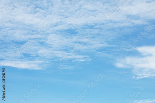 Blue sky background and white clouds soft focus, and copy space