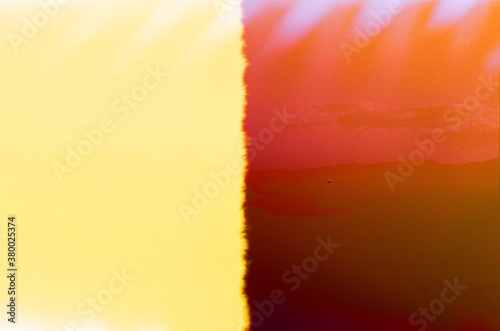film burn of light and dark orange photo