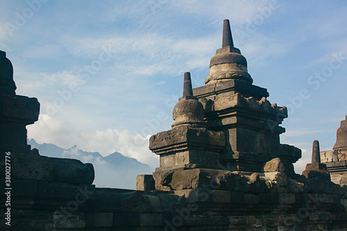 Buddhist temple in front of the mountains photo