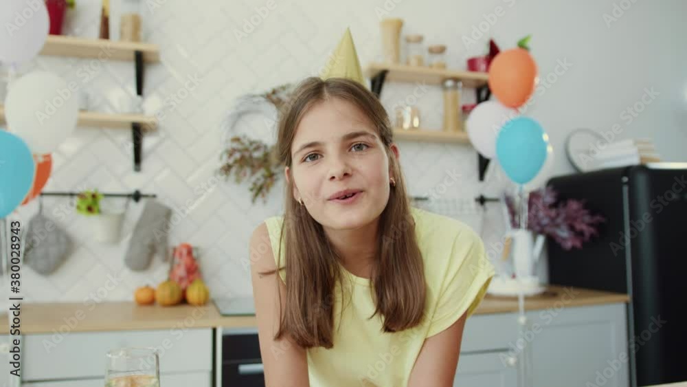 Portrait of pretty girl speaking remote communication on webcam in kitchen interior. Excited young family with children congratulate their grandpa via laptop computer. Social distance. Holidays. Portrait of pretty girl speaking remote communication on webcam in kitchen interior. Excited young family with children congratulate their grandpa via laptop computer. Social distance. Holidays.