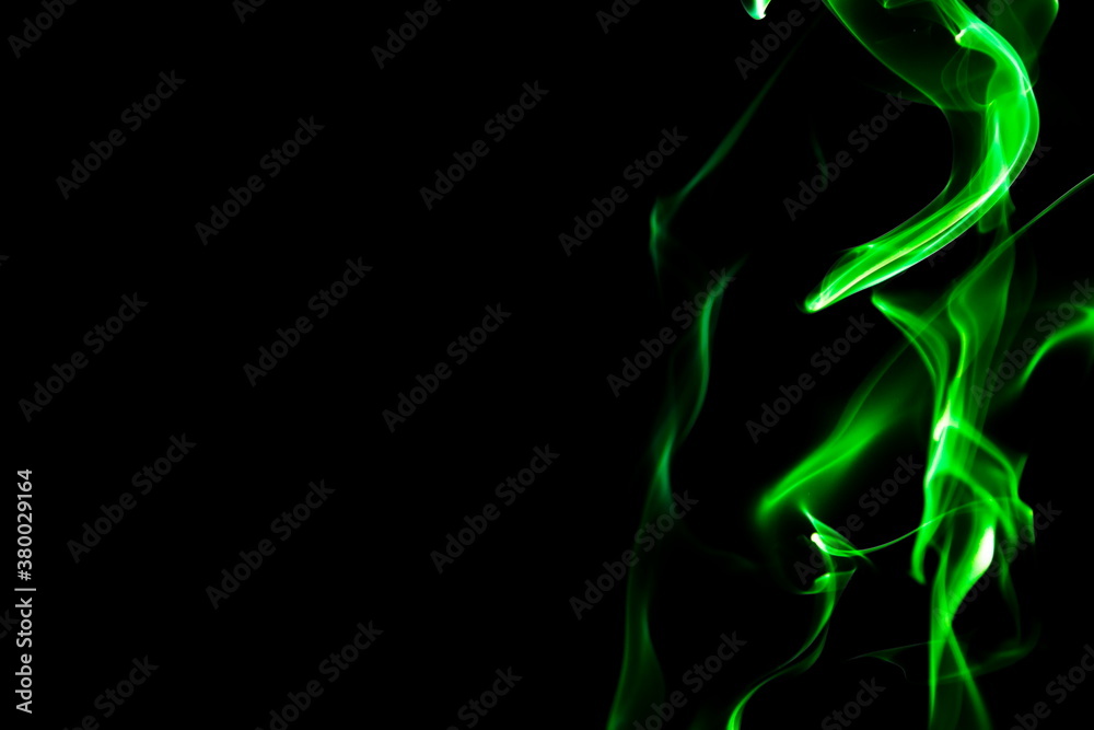 Green smoke on black background Green smoke on black background
