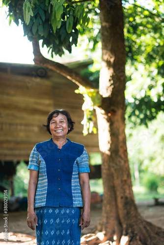 Portrait of Senior Asian woman in traditional indigo clothes photo