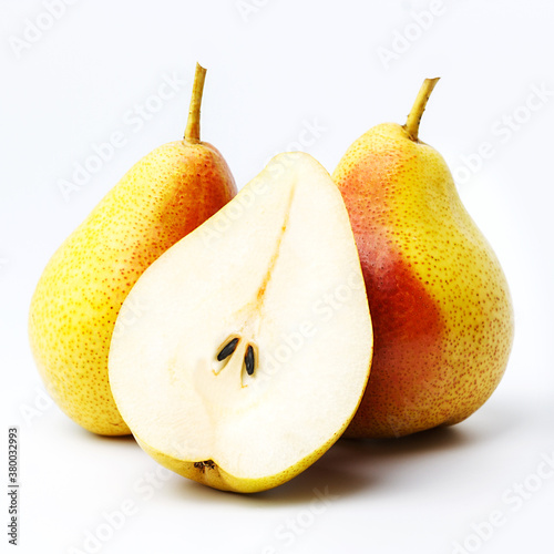 Half and two whole pears on an isolated background.