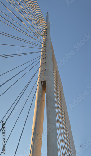 Bridge concrete pylon with barb wires and with a tin top. A unique flexible pylon that holds the entire bridge with cables
