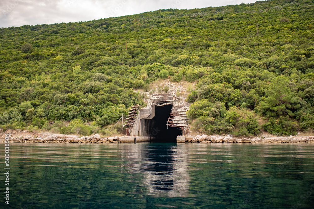 Φωτογραφία Entrance to abandoned submarine shelter, the Bay of Kotor, the Adriatic Sea, Montenegro