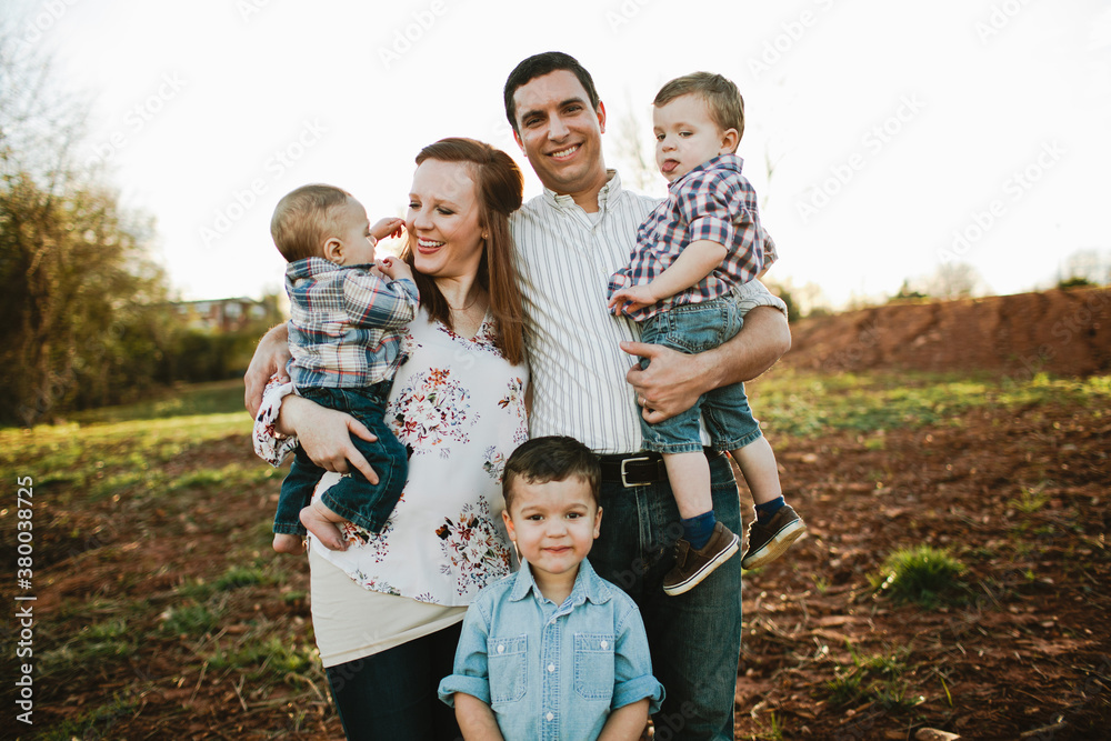 Happy all-boy family outside