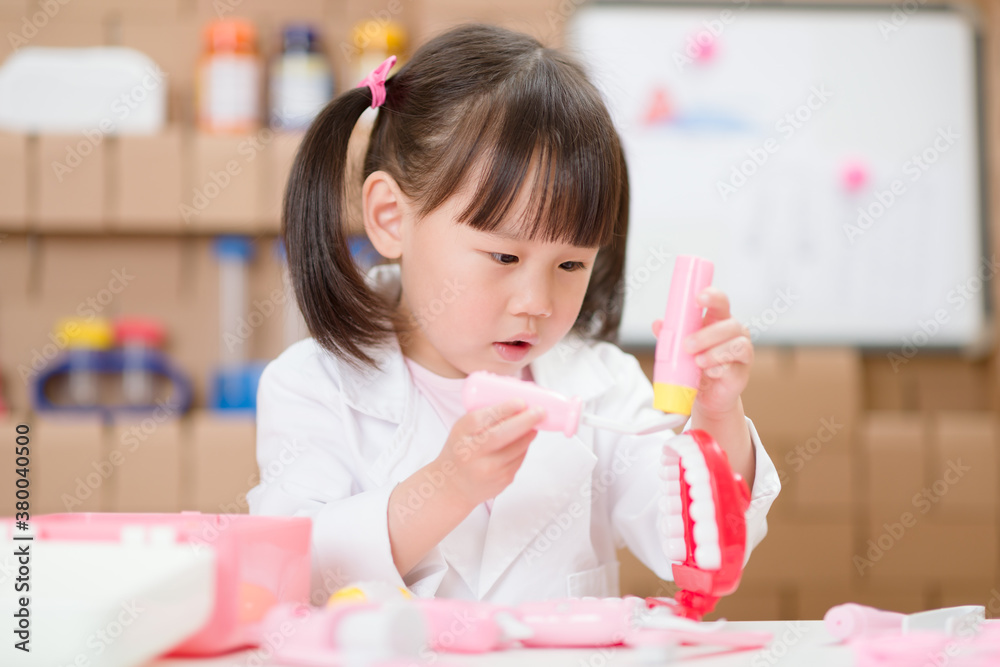 young girl pretend play dentist role at home young girl pretend play dentist role at home