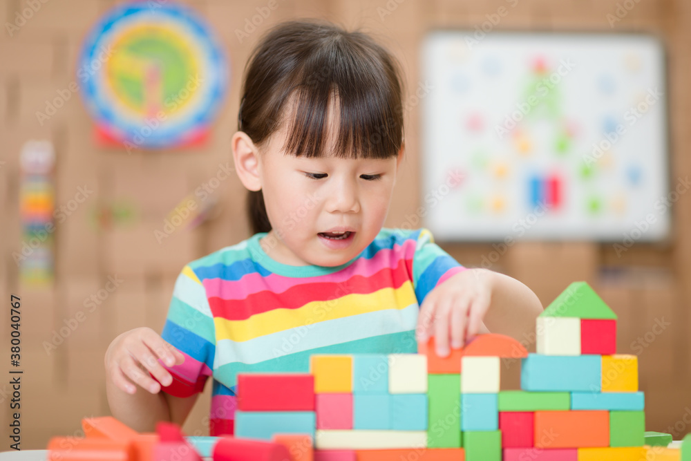 young girl playing creative toy blocks for homeschooling young girl playing creative toy blocks for homeschooling