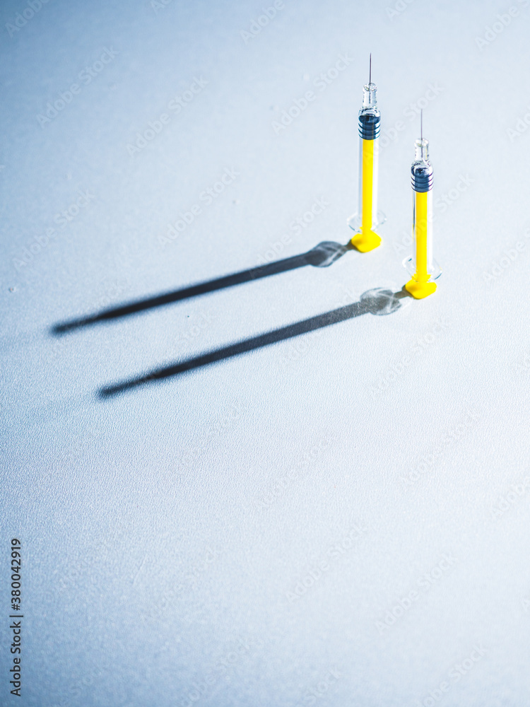 Syringes on a grey background Syringes on a grey background
