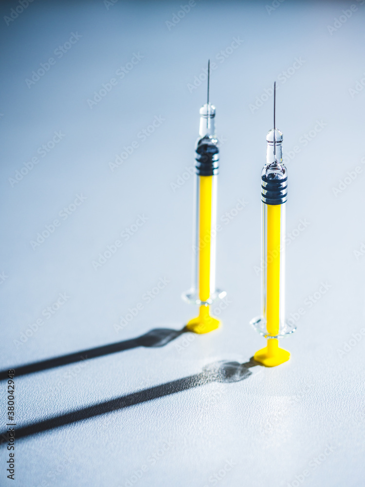 Syringes on a grey background Syringes on a grey background