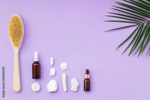 Brand, natural cosmetics for face care on a lovandic background with green leaves.