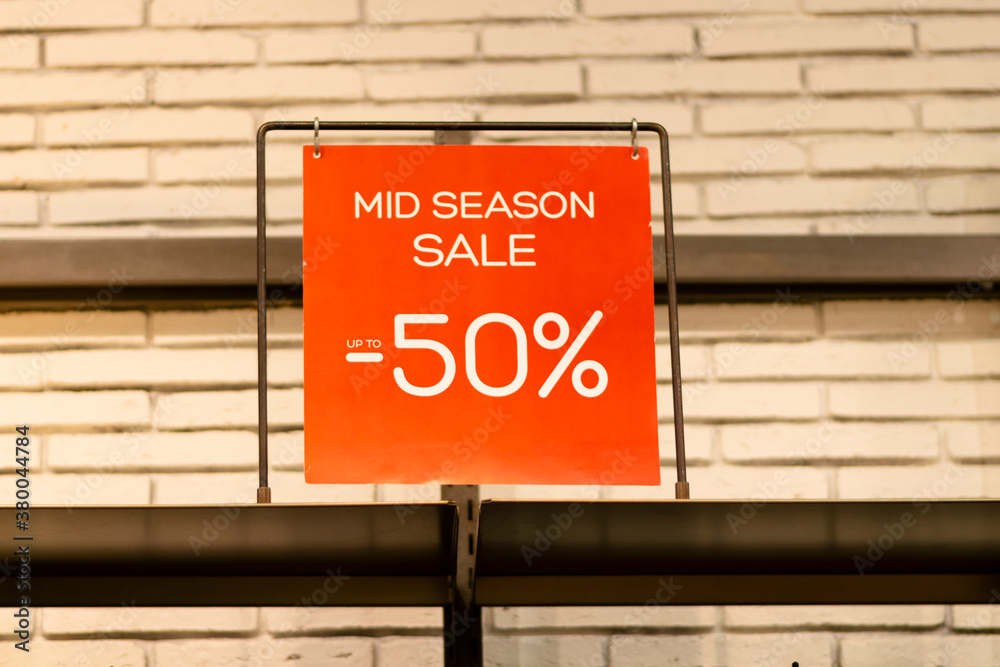 Fototapeta premium A sign that says SEASONAL SALE discount.