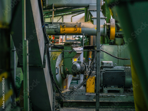 Manufacture of wood pellets. Close-up photo of equipment. Woodworking timber industry: machines and equipment for pressing and cutting sawn timber.