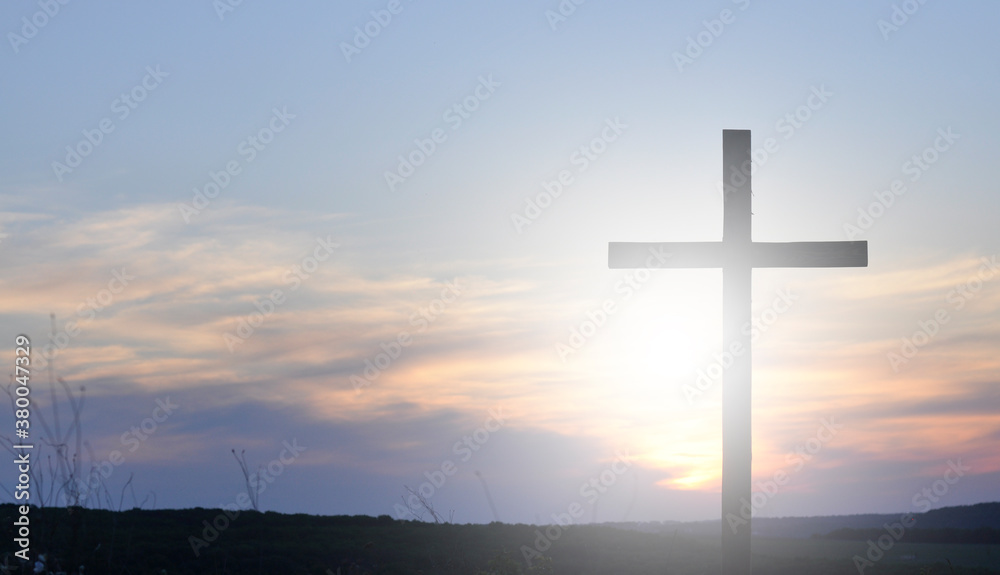 Cross of Jesus. Silhouette of a wooden cross on the background of the sunset
