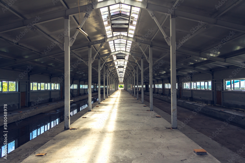 Inside a rural hangar under construction. Construction of an agricultural building. Future empty new barn