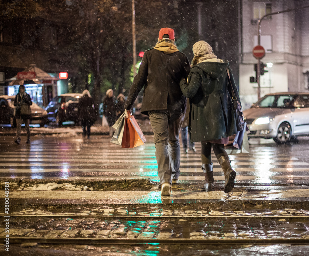 Man and Woman Walking in a Cold Winter Night Man and Woman Walking in a Cold Winter Night