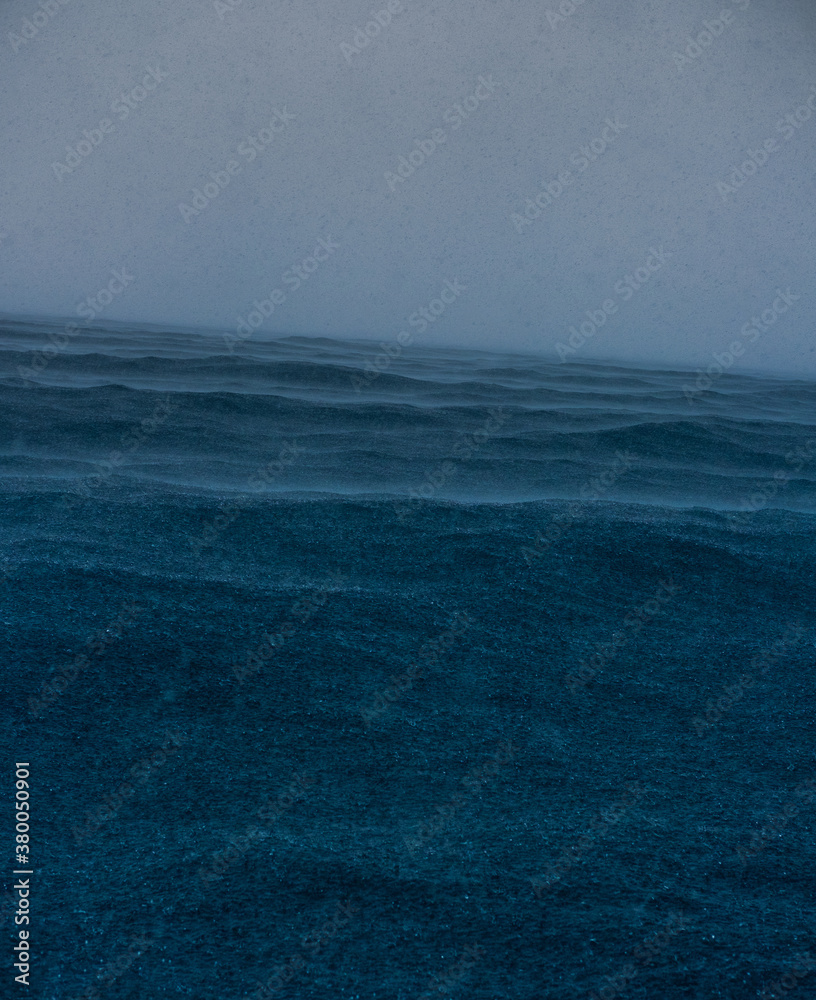 Storm. Strong winds and rain at sea.