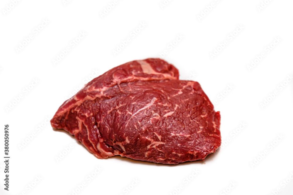 Ramp steak of raw marbled beef lies on a white background, isolated. Ramp steak of raw marbled beef lies on a white background, isolated.