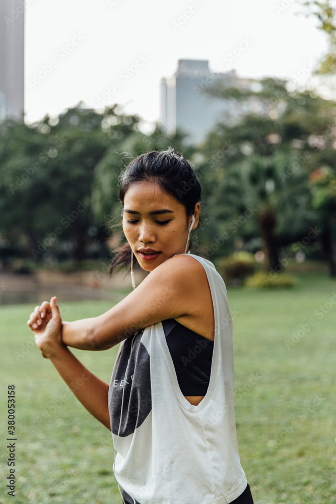 Young Woman Stretching in a Park Young Woman Stretching in a Park
