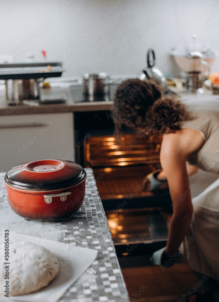 preheating oven cooking freshly mixed homemade bread Stock Photo