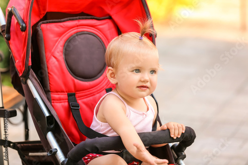 Cute baby in stroller outdoors