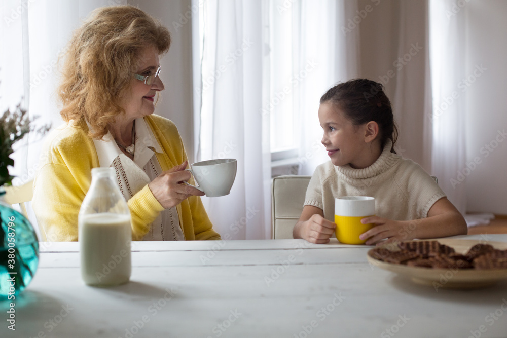 Grandma and Granddaughter Having Breakfast Grandma and Granddaughter Having Breakfast