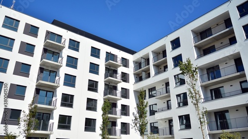 Multistoried modern, new and stylish living block of flats. Newly built apartment building.