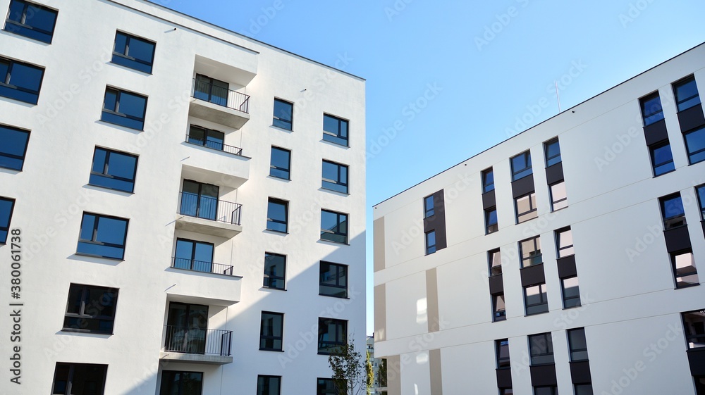 Multistoried modern, new and stylish living block of flats. Newly built apartment building.