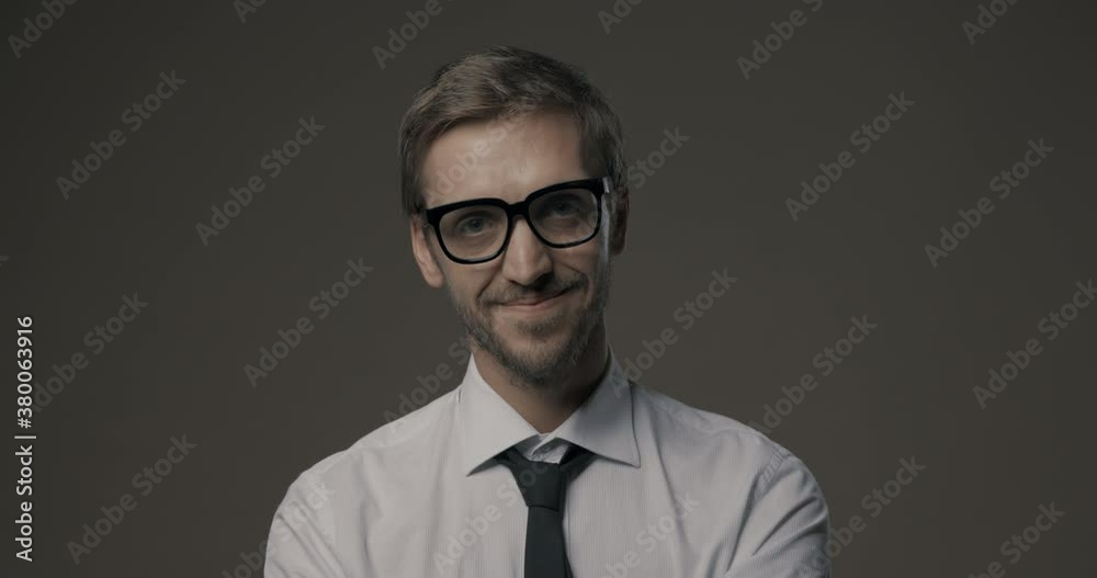 Young businessman smiling at camera Young businessman smiling at camera