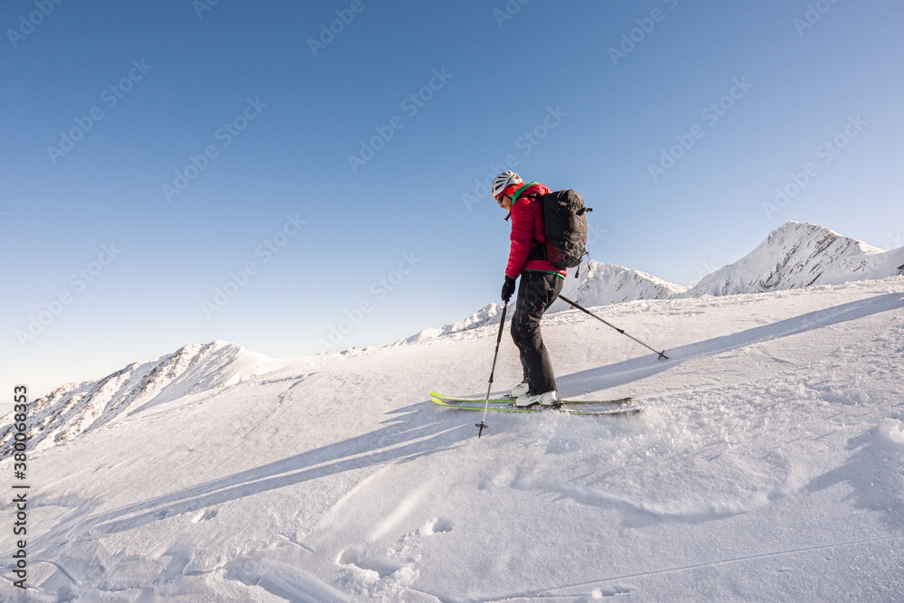 Male skier touring on the top of the mountain Male skier touring on the top of the mountain