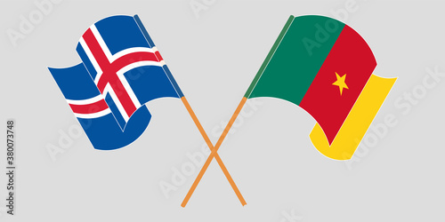 Crossed and waving flags of Cameroon and Iceland