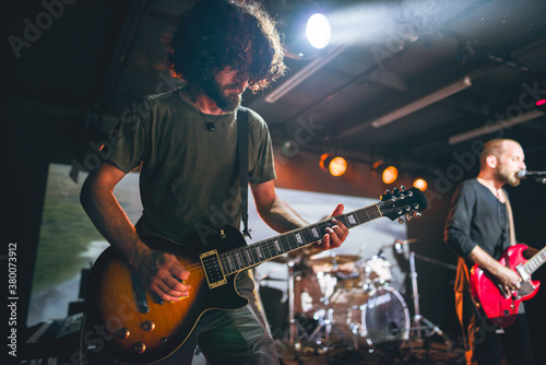 Rock and roll band performing in live concert