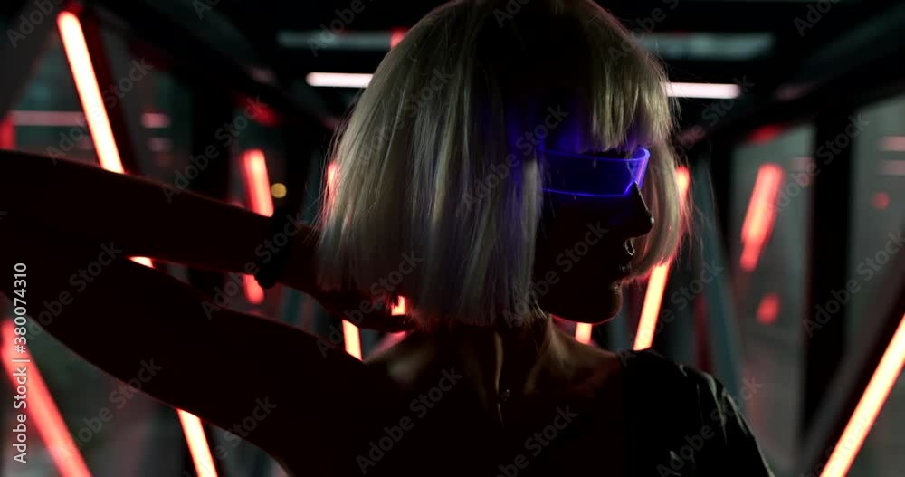 Art cyberpunk video with a woman in glowing glasses. Art cyberpunk video with a woman in glowing glasses.