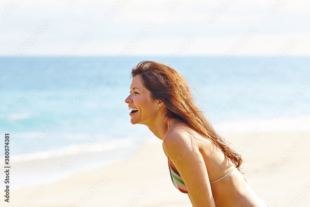 Beautiful woman laughing at tropical beach in Mexico Beautiful woman laughing at tropical beach in Mexico