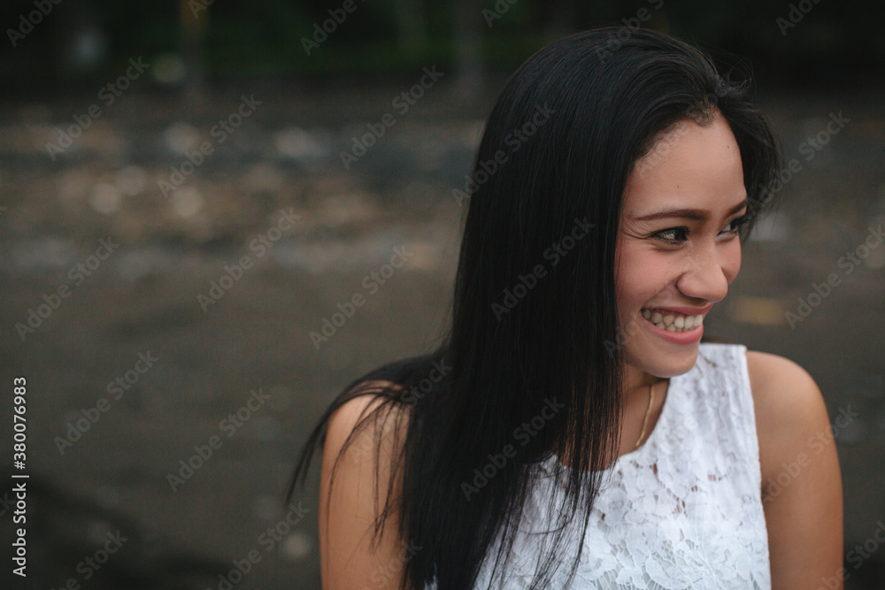 Young balinese woman smiling outside Young balinese woman smiling outside