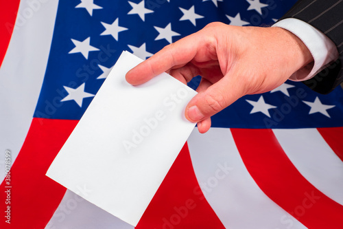 Hand with white paper on US...