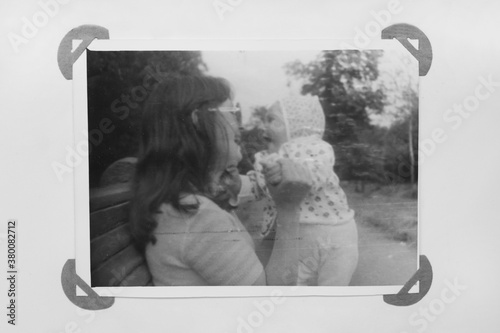 Mother playing with her little baby boy in the park