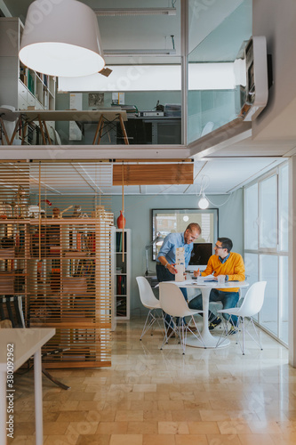 Architects working on proyect in a modern office photo