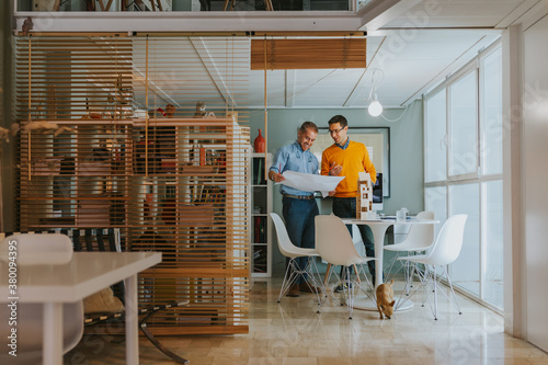 Architects working on proyect in a modern office photo