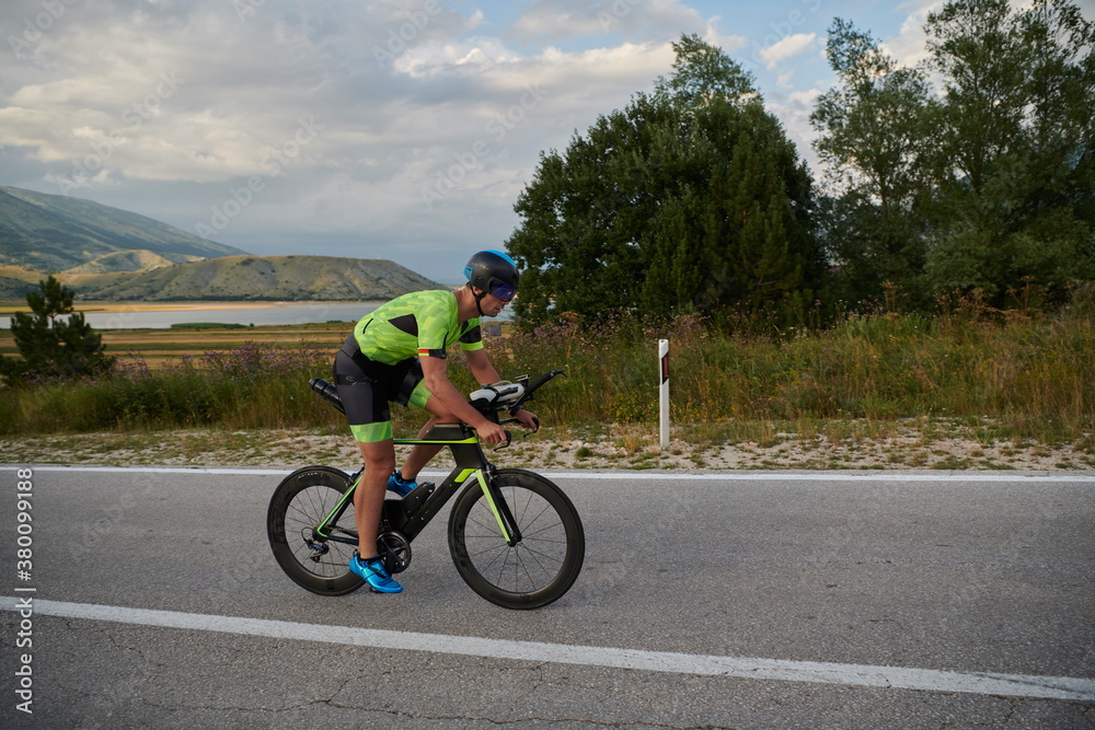 triathlon athlete riding bike triathlon athlete riding bike